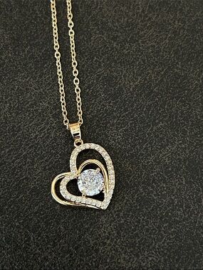 Gold Heart Pendant Necklace with Center Stone